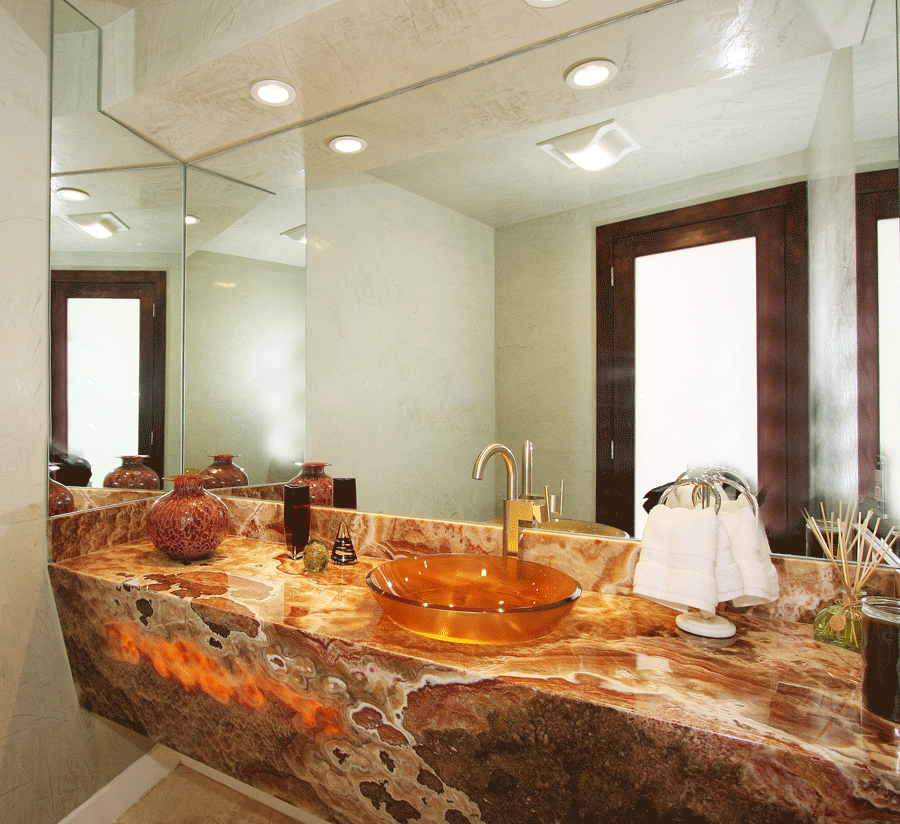 backlit onyx counter with lighted glass-bowl sink
